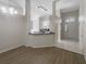 Open-concept living area featuring hardwood floors and high ceilings at 11823 Derbyshire Dr, Tampa, FL 33626