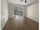 Bright living room with modern decor, a ceiling fan, and a sliding glass door to the lanai at 11823 Derbyshire Dr, Tampa, FL 33626
