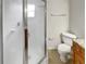 Clean bathroom features a glass-enclosed shower, toilet, and neutral color palette at 9509 Citrus Glen Pl # 11, Tampa, FL 33618