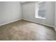 Spacious bedroom with tiled floors, window, and neutral paint at 9509 Citrus Glen Pl # 11, Tampa, FL 33618