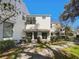 Exterior of building has manicured landscaping and paver walkway and patios at 9509 Citrus Glen Pl # 11, Tampa, FL 33618