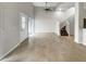 Neutral living room with tile floors, high ceilings, and staircase to the second floor at 9509 Citrus Glen Pl # 11, Tampa, FL 33618