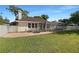 Backyard featuring brick pavers, pool screen, and grass at 2317 Valrico Forest Dr, Valrico, FL 33594