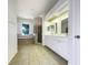 This bathroom has double sinks and a glass shower at 2317 Valrico Forest Dr, Valrico, FL 33594