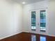 Bedroom with hardwood floors and french doors leading to a pool area at 2317 Valrico Forest Dr, Valrico, FL 33594