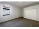 This bedroom features a window for natural light and a closet for storage at 2317 Valrico Forest Dr, Valrico, FL 33594