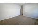 This bedroom boasts neutral walls and carpet flooring at 2317 Valrico Forest Dr, Valrico, FL 33594