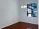Dining room with hardwood floors, chandelier, and window with natural light at 2317 Valrico Forest Dr, Valrico, FL 33594