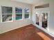 Florida room with hardwood floors, pool view, and direct access to the outdoors via glass doors at 2317 Valrico Forest Dr, Valrico, FL 33594
