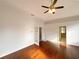 Bedroom or office with hardwood floors, ceiling fan, and french doors to an adjoining room at 2317 Valrico Forest Dr, Valrico, FL 33594