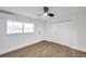 Cozy bedroom with ceiling fan, wood-look floors, and ample closet space at 2353 Shelley St # 8, Clearwater, FL 33765