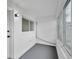 View of enclosed porch area with lighting fixture and multiple windows at 2353 Shelley St # 8, Clearwater, FL 33765