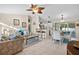 Open living space with a view of the kitchen, dining area, and living room at 3699 N Chamberlain Blvd, North Port, FL 34286
