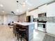 Modern kitchen with stylish island, stainless steel appliances, and open floor plan at 11826 Sky Acres Ter, Bradenton, FL 34211