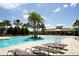 Inviting pool area with lounge chairs and covered pavilion at 11826 Sky Acres Ter, Bradenton, FL 34211