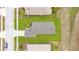 Aerial top down view of the home displaying a long driveway and manicured lawn at 13202 Golf Ridge Pl, Hudson, FL 34669