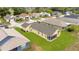 Lovely home featuring a screened-in lanai and manicured green lawn in a quiet neighborhood at 13202 Golf Ridge Pl, Hudson, FL 34669