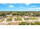 Scenic aerial view of a residential area featuring well-maintained homes and mature trees at 13202 Golf Ridge Pl, Hudson, FL 34669