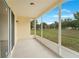 This screened patio offers a seamless transition to the outdoors at 13202 Golf Ridge Pl, Hudson, FL 34669