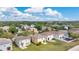 Wide aerial view of homes showing the neighborhood's layout and well-maintained green spaces, offering a peaceful suburban setting at 19648 Timberbluff Dr, Land O Lakes, FL 34638