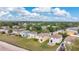 Scenic aerial view of neighborhood houses showing the community's layout and proximity to the surrounding wooded areas at 19648 Timberbluff Dr, Land O Lakes, FL 34638