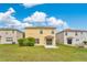 Spacious backyard features green grass, a patio, and a view of the home's exterior at 19648 Timberbluff Dr, Land O Lakes, FL 34638