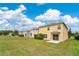 Spacious backyard view of homes featuring expansive green lawns that create a private and serene outdoor living space at 19648 Timberbluff Dr, Land O Lakes, FL 34638
