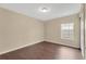 Empty bedroom with a window and neutral walls at 19648 Timberbluff Dr, Land O Lakes, FL 34638
