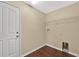 Walk-in closet with overhead shelf, electrical outlets, and laminate flooring at 19648 Timberbluff Dr, Land O Lakes, FL 34638