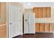 Kitchen showcases bright cabinets, white appliances, and dark flooring at 19648 Timberbluff Dr, Land O Lakes, FL 34638
