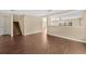 Open concept living room with wood stairs and dark hardwood floors at 19648 Timberbluff Dr, Land O Lakes, FL 34638