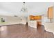 Spacious living area with modern flooring that opens to the kitchen at 19648 Timberbluff Dr, Land O Lakes, FL 34638