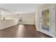 Light and airy living room features neutral paint and attractive flooring at 19648 Timberbluff Dr, Land O Lakes, FL 34638