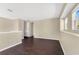 Spacious loft with multiple windows providing natural light and dark wood-look flooring at 19648 Timberbluff Dr, Land O Lakes, FL 34638