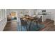 Inviting living space open to the kitchen and dining area, showcasing contemporary furniture, natural light, and modern décor at 14699 Italy Ave, Dade City, FL 33523