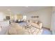 Spacious living room featuring neutral furniture, open to the dining area, with light-colored walls and ample natural light at 14699 Italy Ave, Dade City, FL 33523