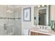 Bathroom with glass-enclosed shower, modern vanity, and stylish fixtures at 1785 Trailhead Ln, Zephyrhills, FL 33541