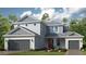 Charming two-story home with a two-car garage and well-manicured landscaping at 1785 Trailhead Ln, Zephyrhills, FL 33541