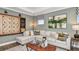 Comfortable game room with a large sectional sofa, and decorative accents at 1785 Trailhead Ln, Zephyrhills, FL 33541