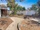 Landscaped backyard with winding pathway and a privacy fence at 2826 46Th S St, Gulfport, FL 33711