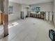 Spacious living room featuring tile flooring, bright windows, and ready for renovation at 2826 46Th S St, Gulfport, FL 33711