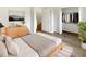 Bright bedroom featuring hardwood floors, closet, and lots of natural light and modern decor at 1238 Standridge Dr, Wesley Chapel, FL 33543