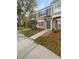 A townhome featuring well-maintained landscaping, neutral colors, and a cozy front entrance at 1238 Standridge Dr, Wesley Chapel, FL 33543