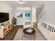 Bright living room featuring hardwood floors, modern decor, and lots of natural light and open floor plan at 1238 Standridge Dr, Wesley Chapel, FL 33543
