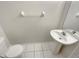 Powder room with a pedestal sink, tiled floor, and a toilet at 1238 Standridge Dr, Wesley Chapel, FL 33543