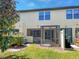 Exterior showing the backyard, screened patio and well-maintained lawn creating a relaxing outdoor space at 1998 Milkweed Trce, Lutz, FL 33558