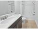 Bathroom with modern vanity, bathtub, shower, and sleek fixtures for a spa-like feel at 1998 Milkweed Trce, Lutz, FL 33558