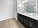 Bathroom with double sink, modern vanity, and walk-in shower for a relaxing experience at 1998 Milkweed Trce, Lutz, FL 33558