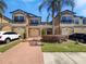 Inviting two-story townhome with charming curb appeal and paver driveway at 1998 Milkweed Trce, Lutz, FL 33558