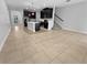 Spacious open-concept design with tile flooring and stairs to the second floor at 1998 Milkweed Trce, Lutz, FL 33558